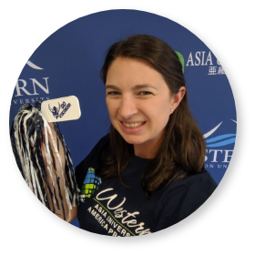 IEP advisor Karissa Ringel smiling in front of a blue Western Background