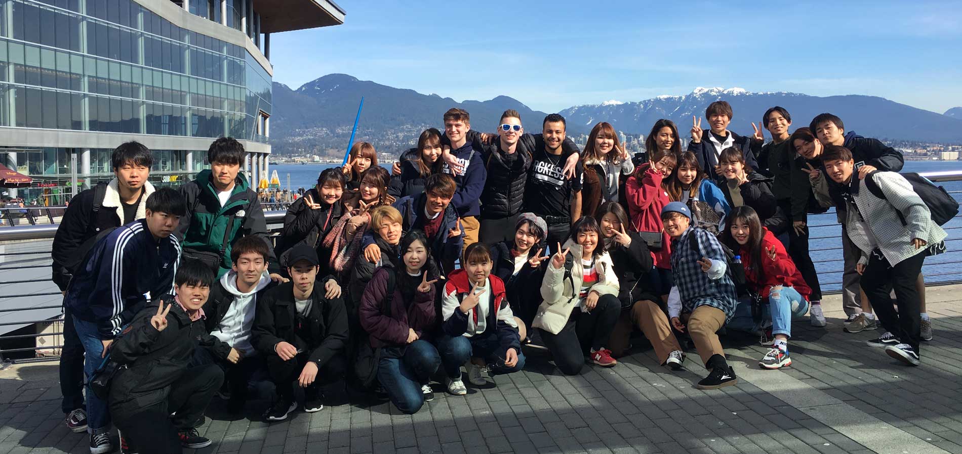 Group of students smiling on an excursion to Vancouver.