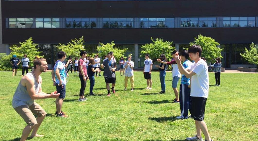 Group of AUAP students doing an egg toss