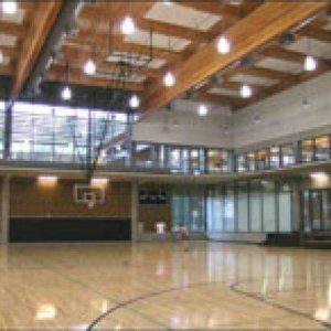 Large gymnasium space with polished floors and high ceilings